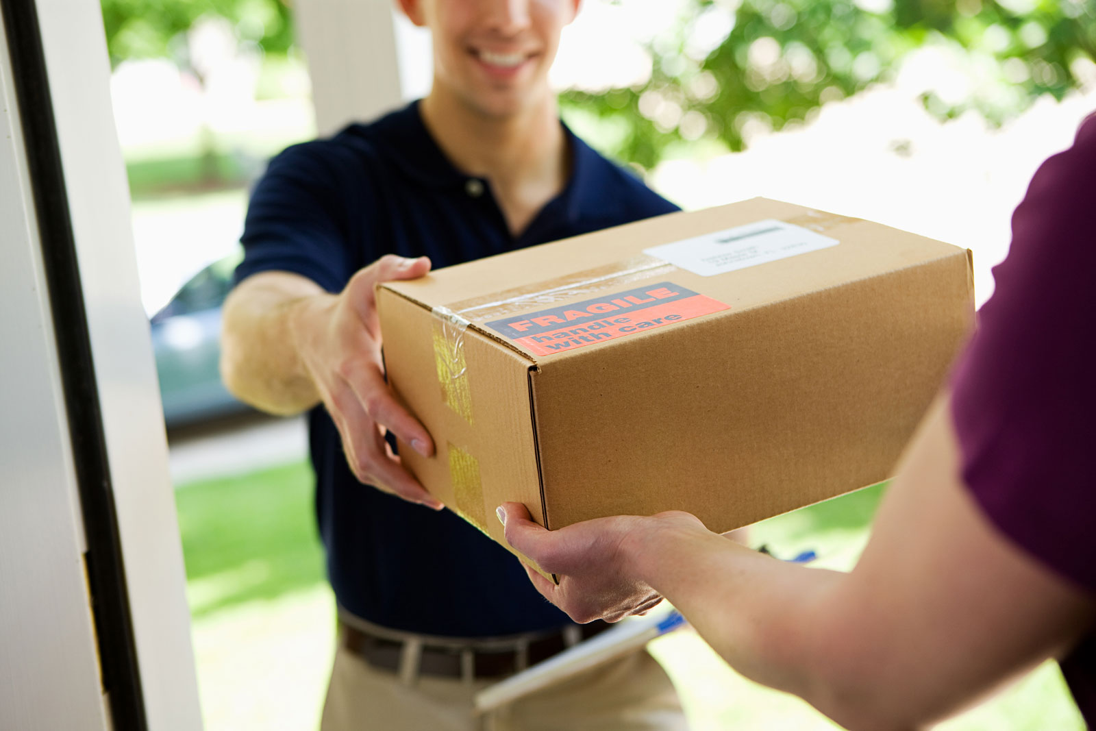 deliveryman delivering package to home