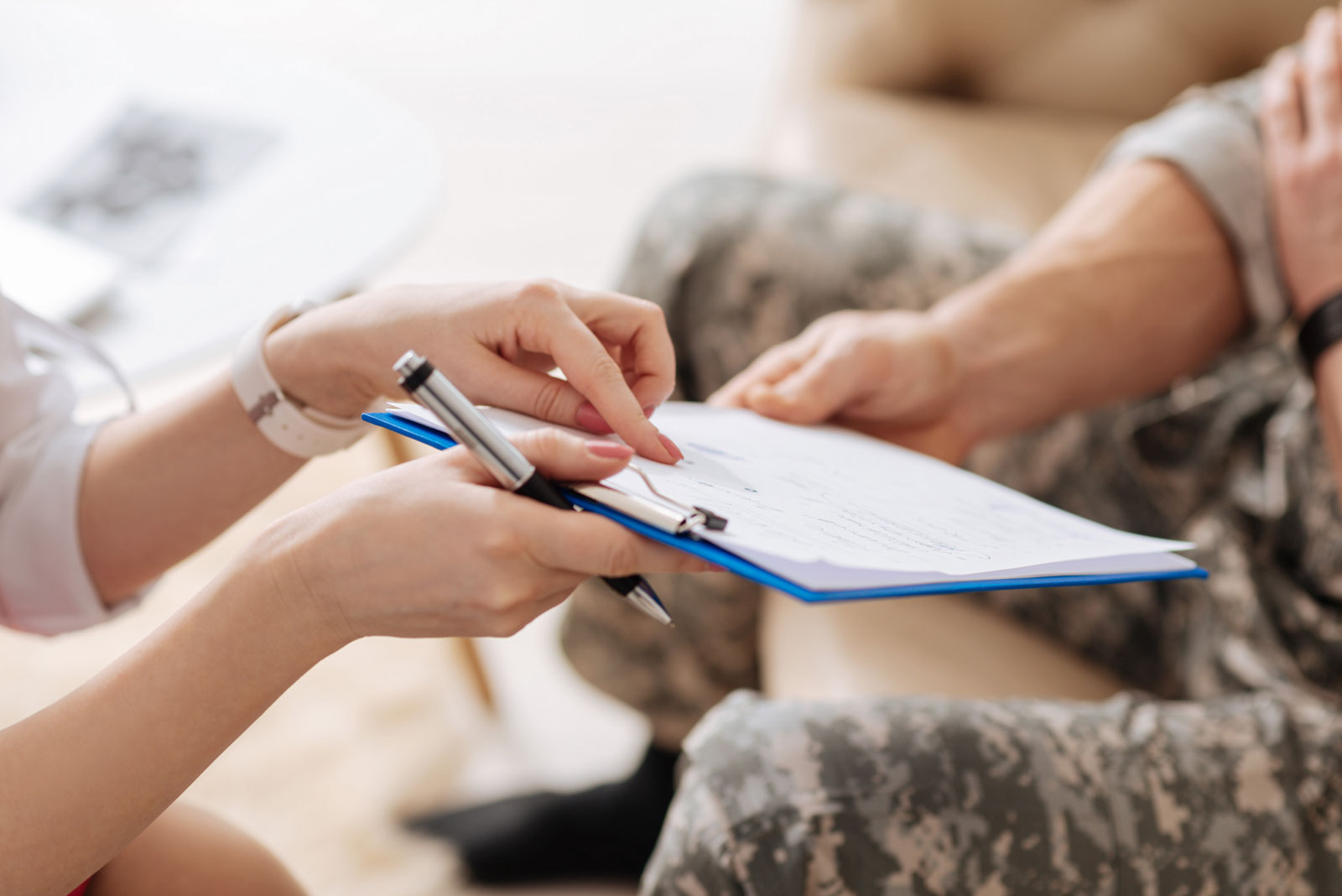 uniformed man paperwork doctors office