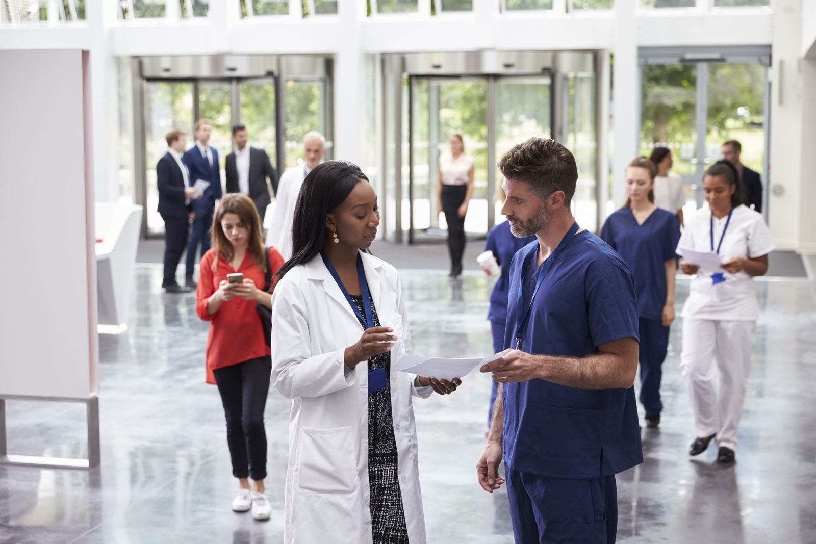 hospital staff in lobby chatting