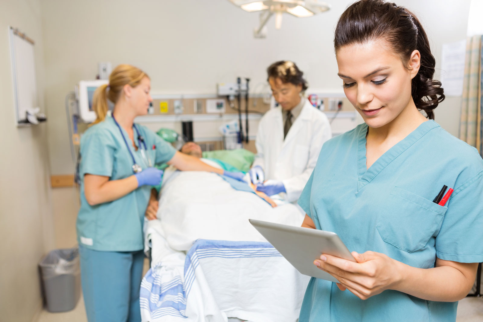 nurses and doctors helping patient